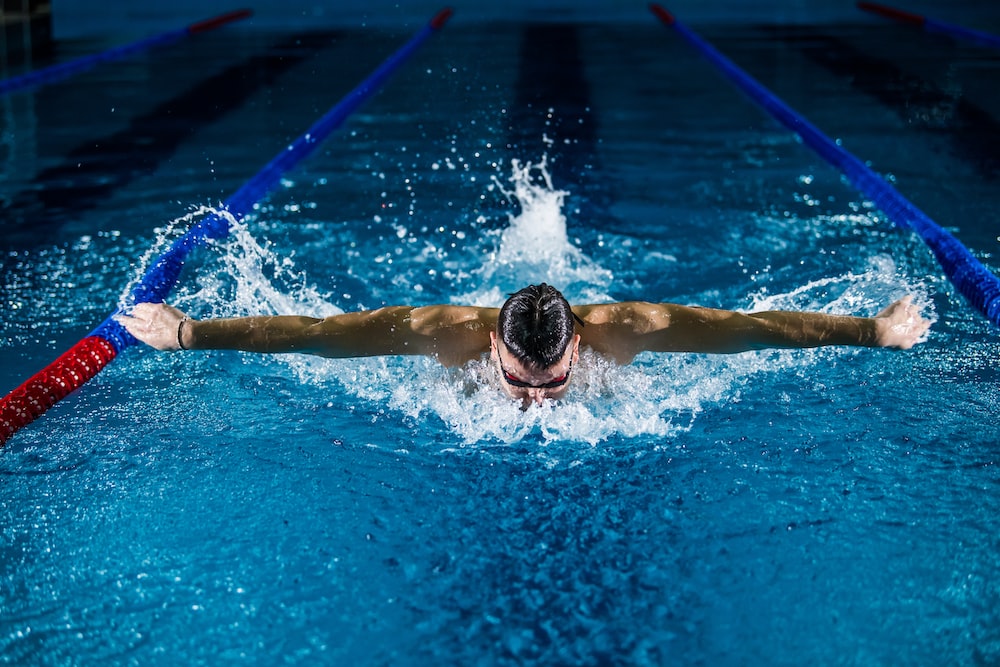 man doing butterfly stroke